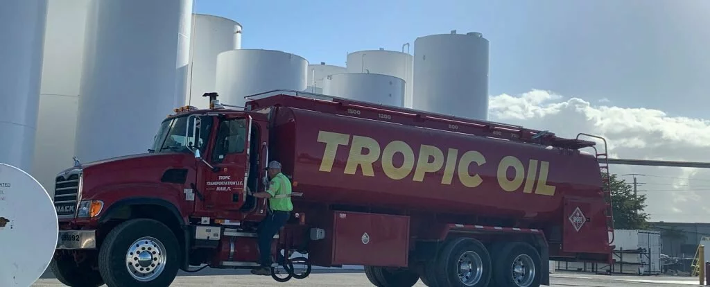 Tropic Oil red tanker truck carrying premium fuel in Florida.