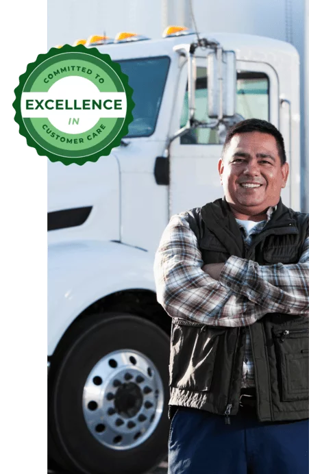  2026/07/smiling-driver-standing-by-white-semi-truck-2.webp 