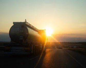  2026/07/tanker-truck-driving-at-sunset-1.jpeg 