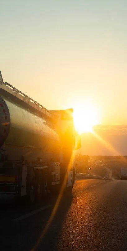  2026/07/tanker-truck-driving-at-sunset.webp 